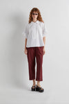 White shirt with pleated shoulder detail