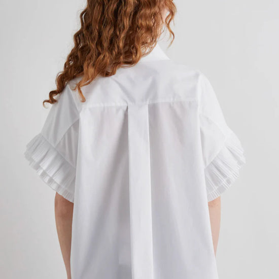 Rear view of white shirt with pleated seeve detail