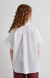 Rear view of white shirt with pleated seeve detail