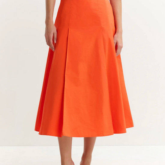 Bright orange skirt worn with white tee