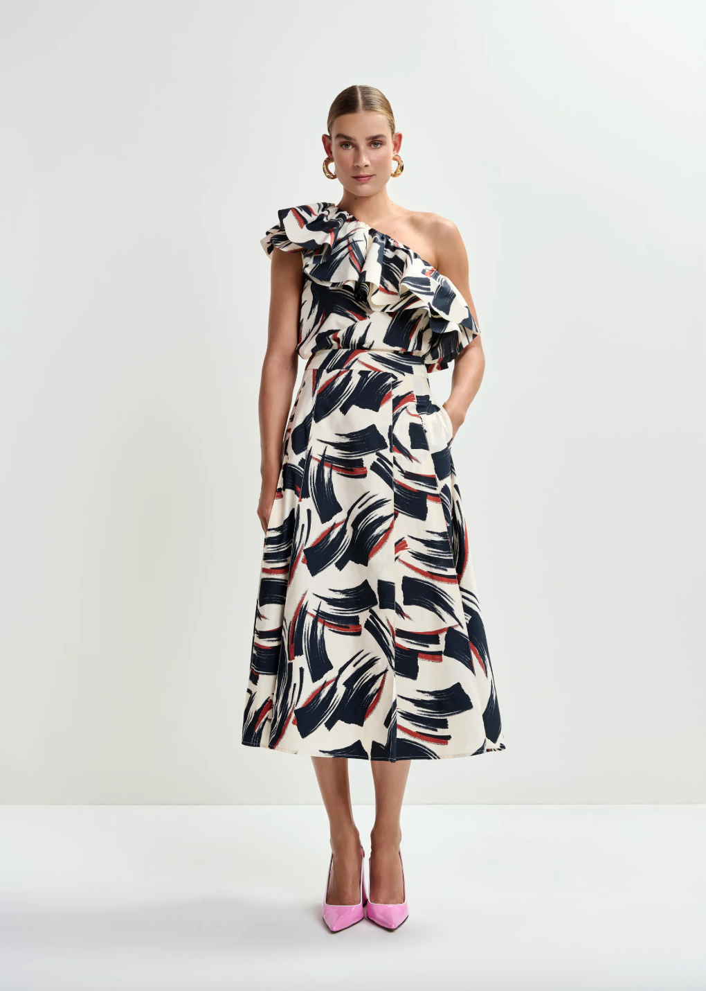 One shoulder top worn with matching skirt