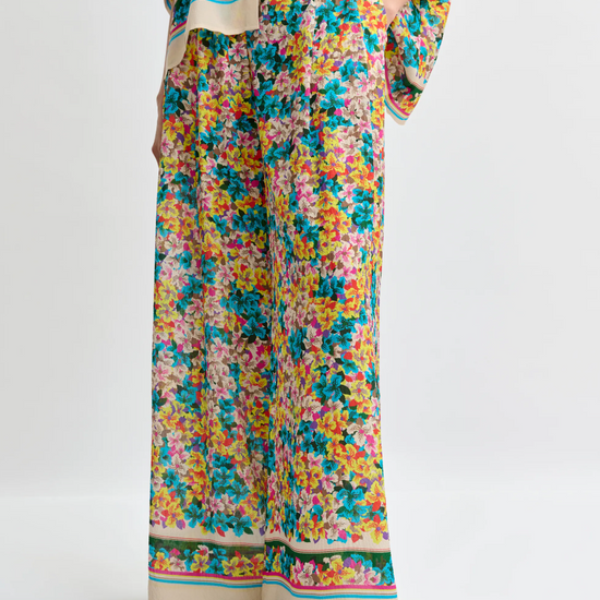 Colorful floral dress with a white background