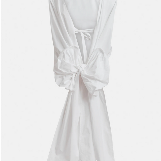 White sleeveless top with a knot detail on a white background