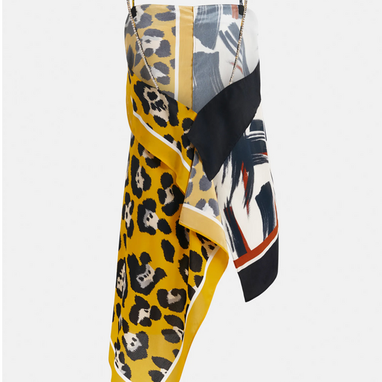 Multicolored dress with leopard print and abstract patterns on a white background