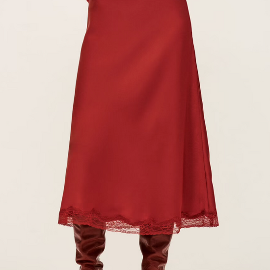 red polyester mid length skirt with lace trim and side zip from ba&sh model shot