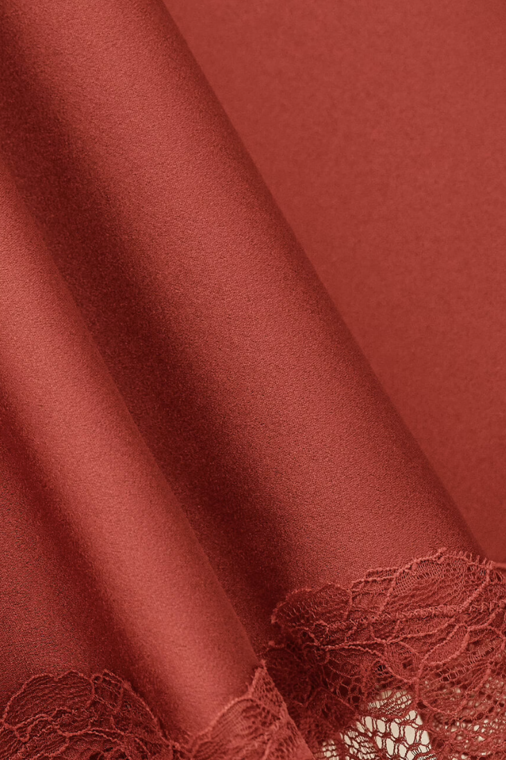 red polyester mid length skirt with lace trim and side zip from ba&sh close up