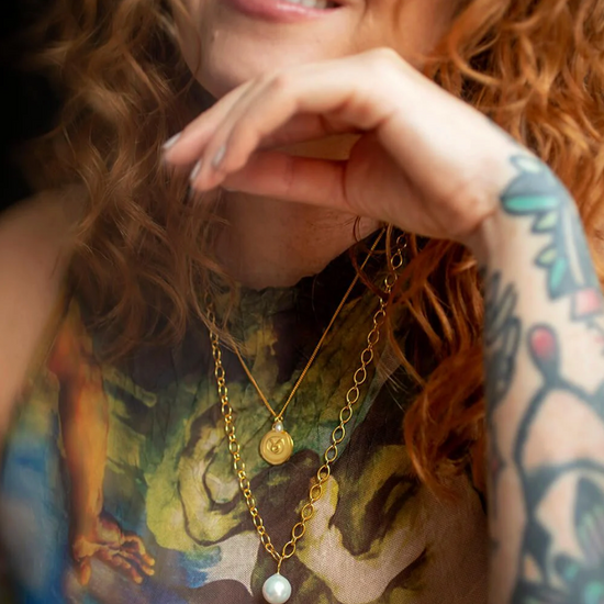 gold chain necklace with statement pearl from claudia bradby model shot