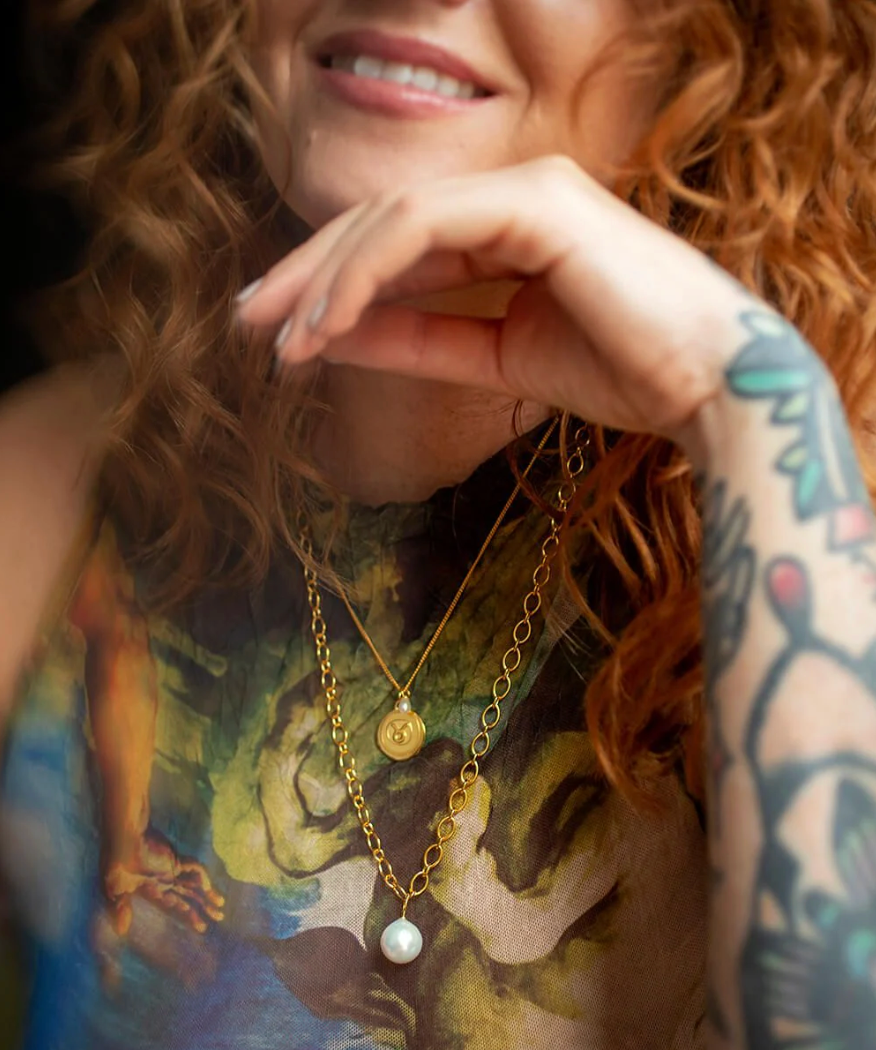 gold chain necklace with statement pearl from claudia bradby model shot