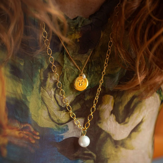 gold chain necklace with statement pearl from claudia bradby model shot