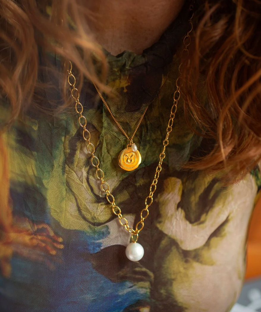 gold chain necklace with statement pearl from claudia bradby model shot