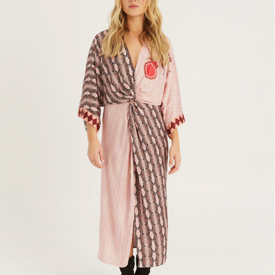 V neck dress in print with 3/4 length sleeves worn with black boots