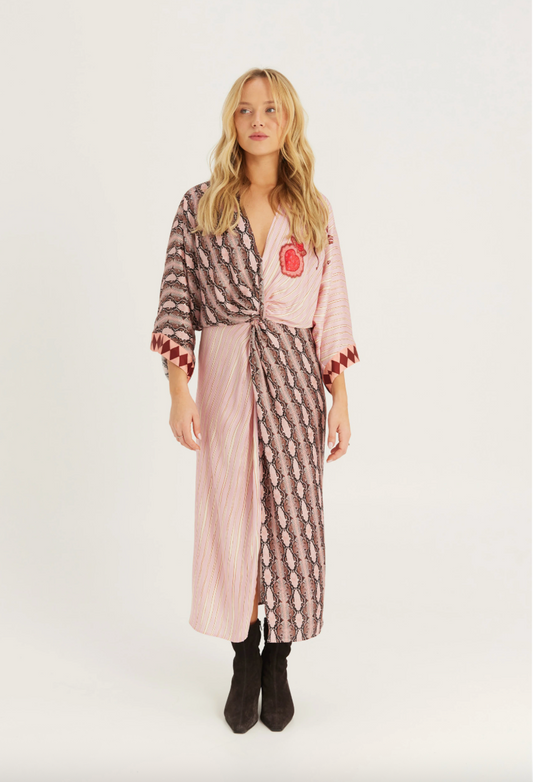 V neck dress in print with 3/4 length sleeves worn with black boots