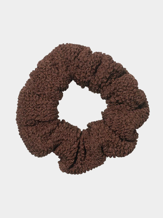 Brown scrunchie on a light gray background