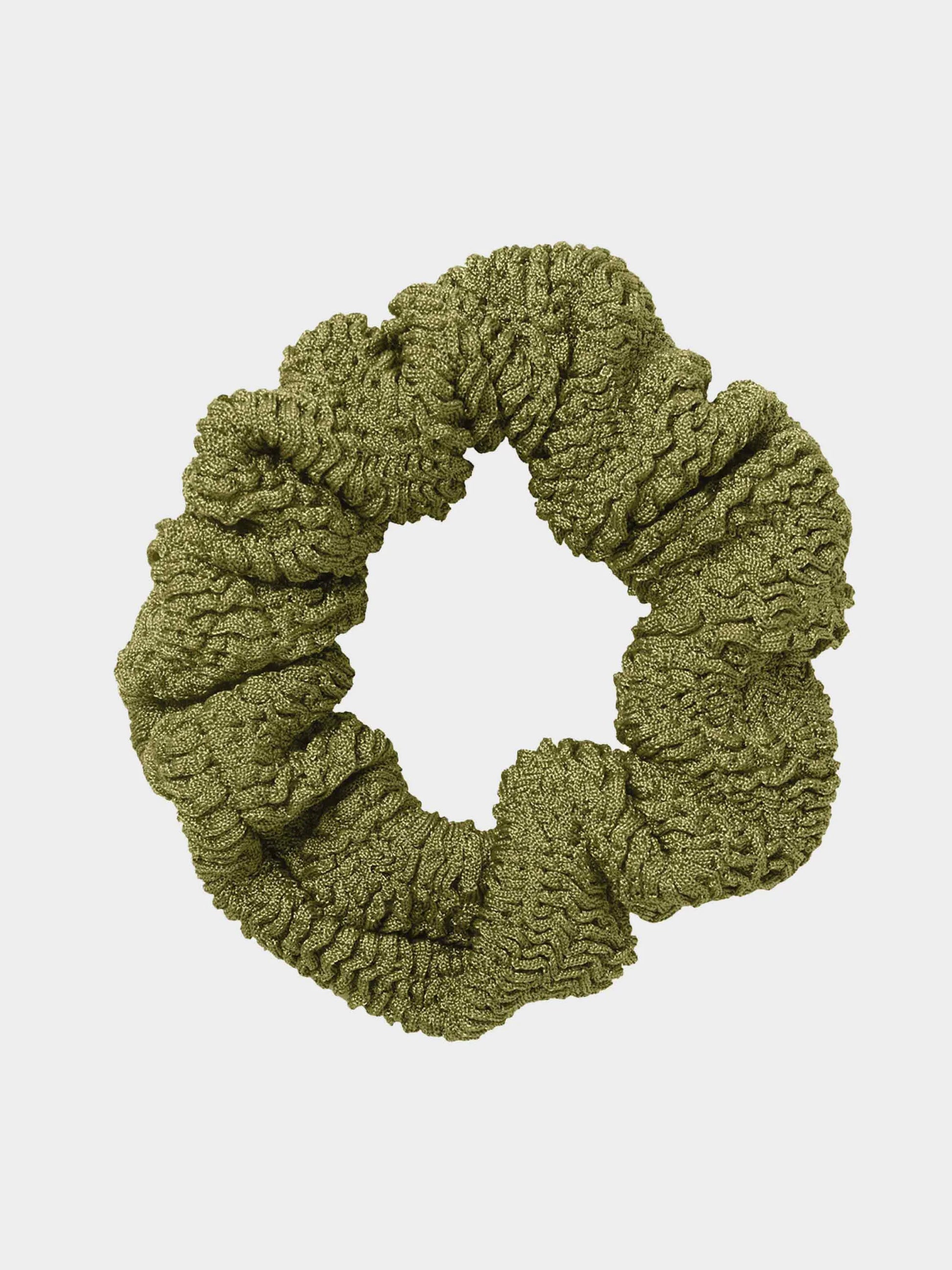 Green scrunchie on a light gray background