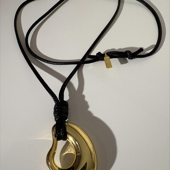 Long cord necklace with gold pendant from talis Chains