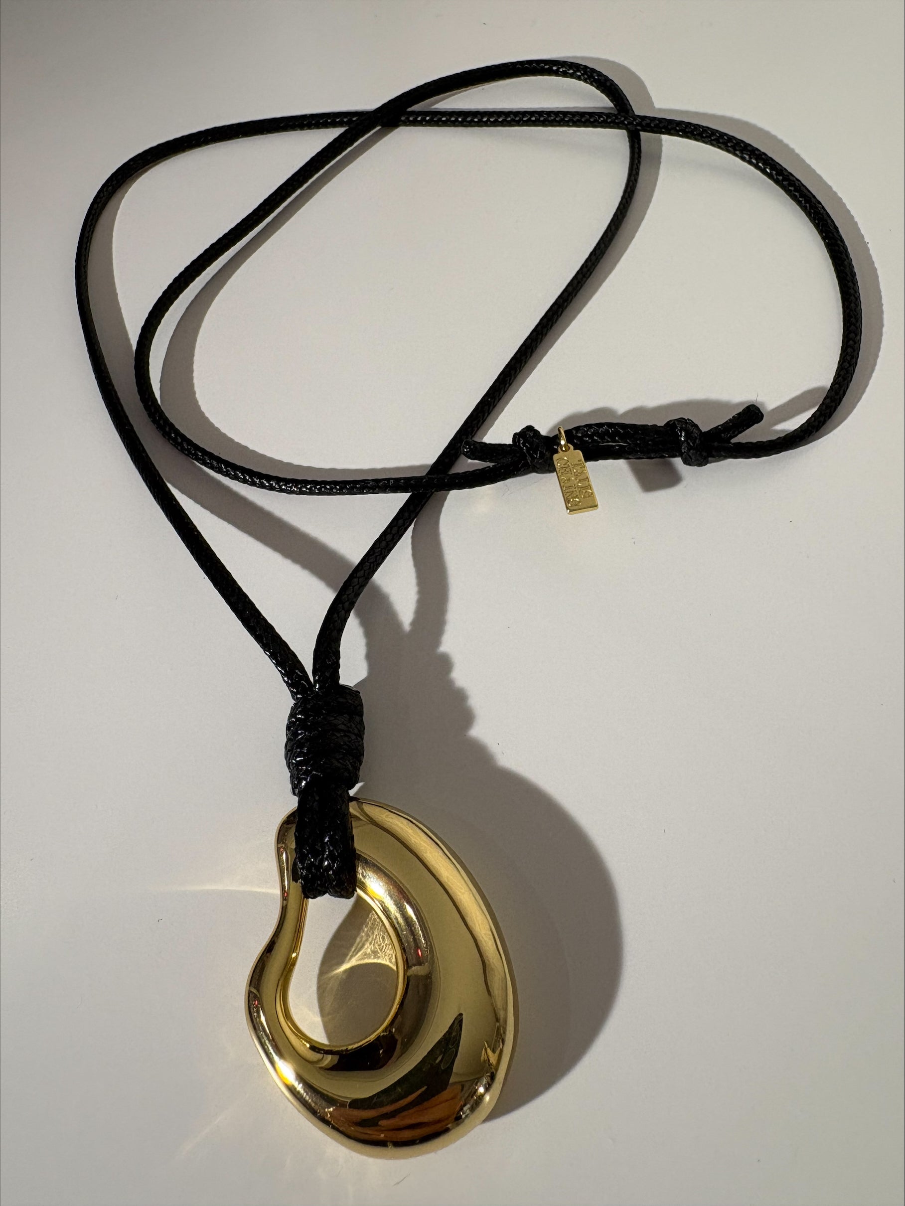 Long cord necklace with gold pendant from talis Chains