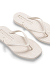 white flipflop on white background another angle