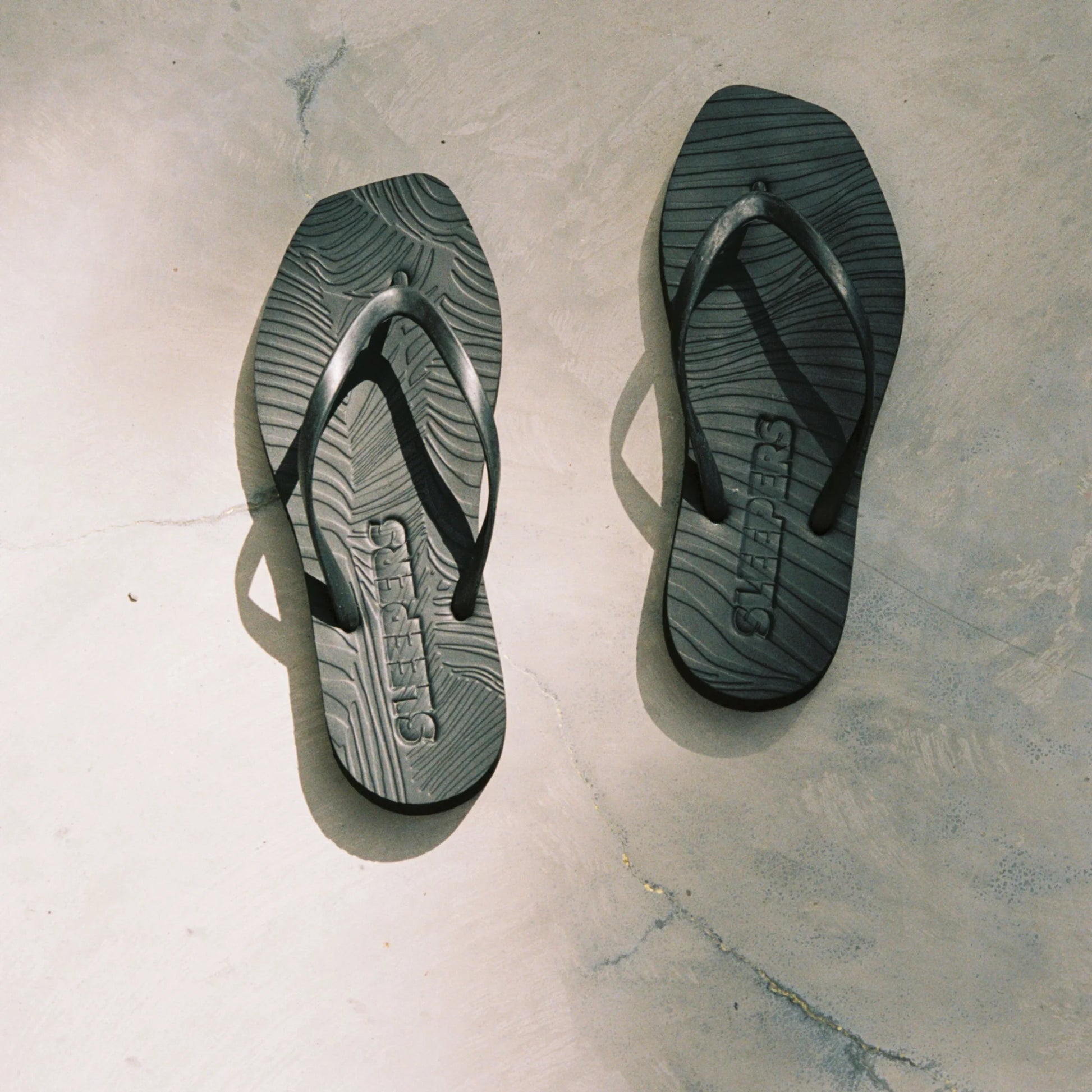 Square toe black rubber flip flops from sleepers 