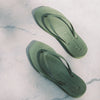 Square toe green rubber flip flops from sleepers