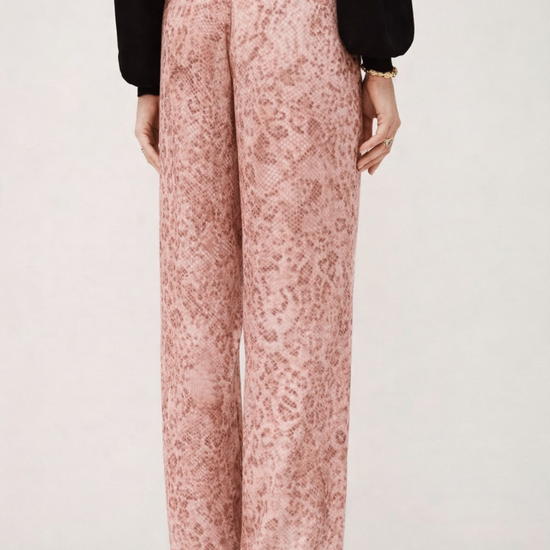 Rear view of pink animal print satin trousers with black knit from ba&sh