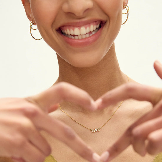 love retro inspired gold necklace from rachel jackson model shot