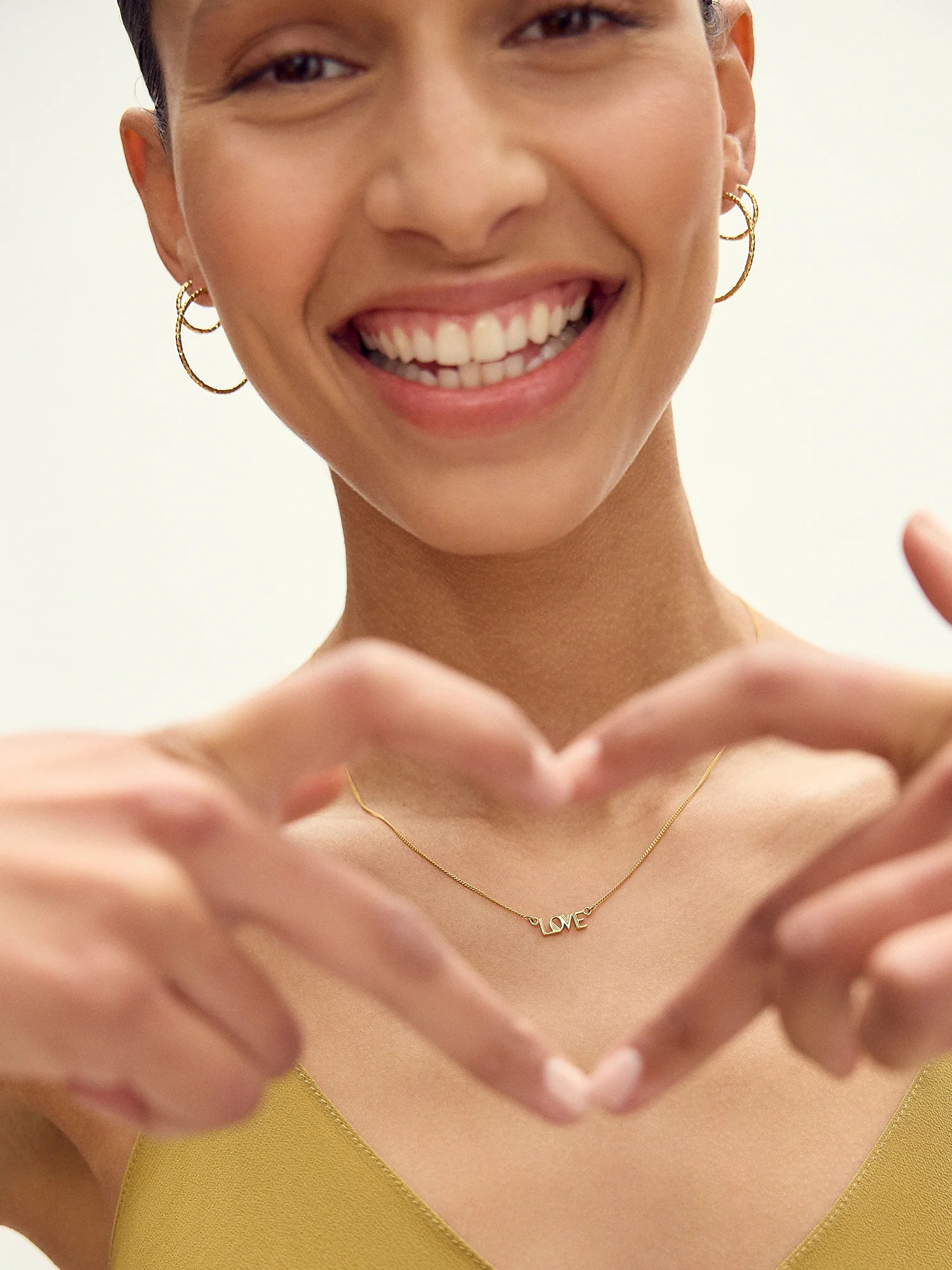 love retro inspired gold necklace from rachel jackson model shot