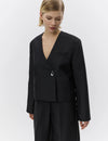 v neck black blazer with flared sleeves and single statement button from day birger close up
