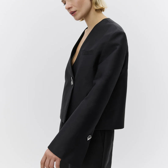 v neck black blazer with flared sleeves and single statement button from day birger side view