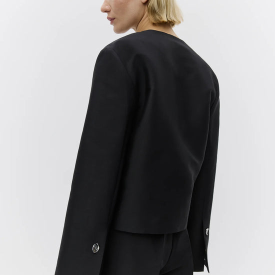 v neck black blazer with flared sleeves and single statement button from day birger rear view