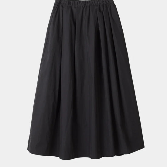 A black pleated A-line skirt with an elastic waistband, shown against a plain light gray background.