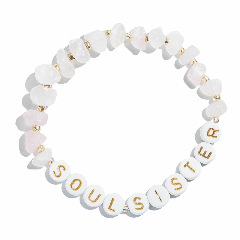 Pink crystal bracelet with white beads spelling "Soul sister""