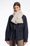 light beige long faux fur rectangular scarf with slit to enable to cross into itself model shot