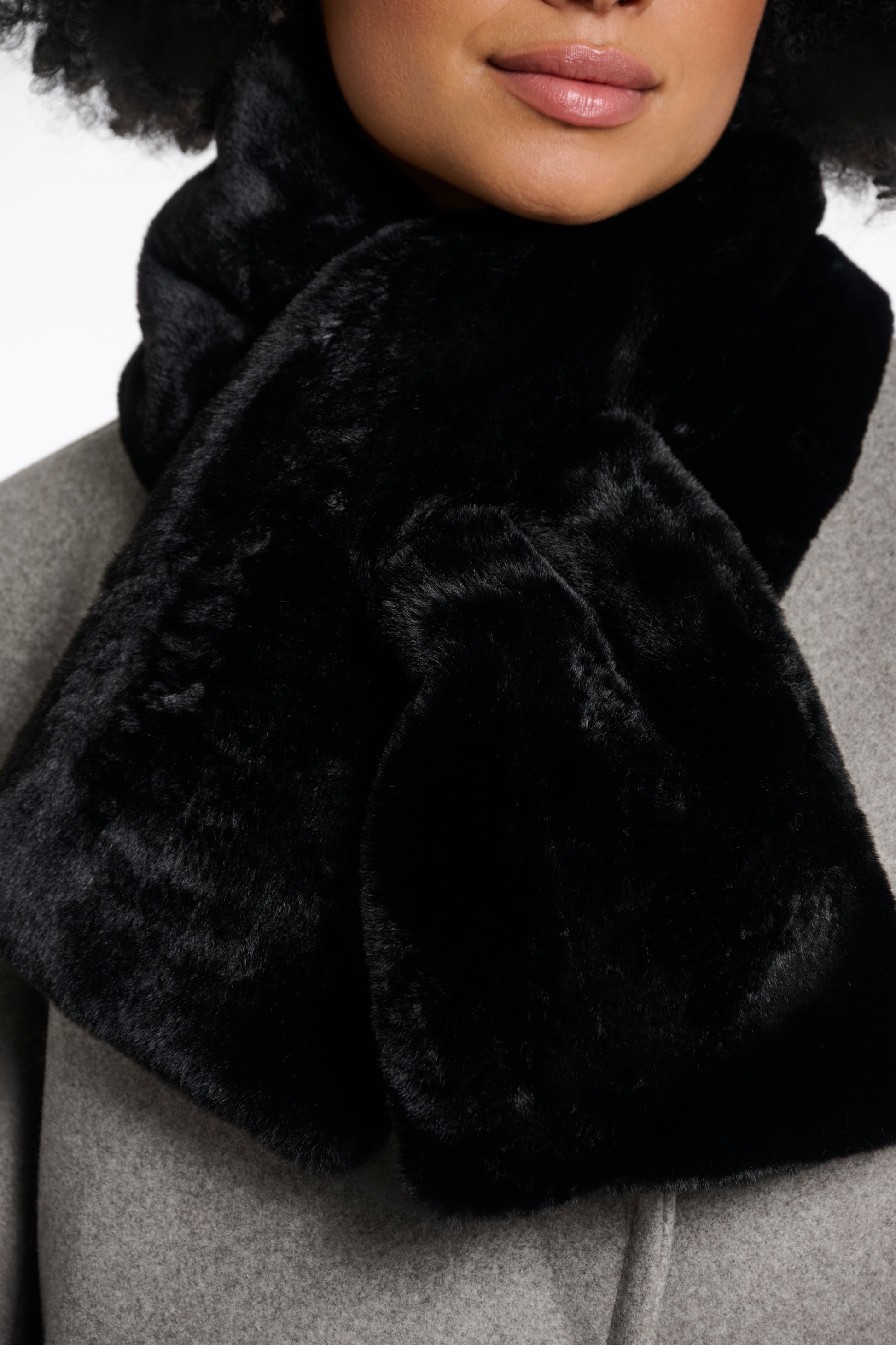 black faux fur long rectangular shaped scarf which can cross into itself
