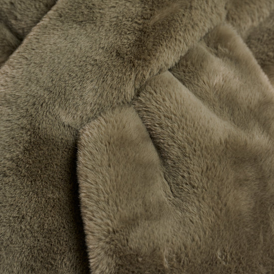 green long faux fur rectangular scarf with slit to enable to cross into itself close up