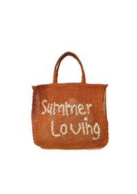 Orange woven bag with neutral writing