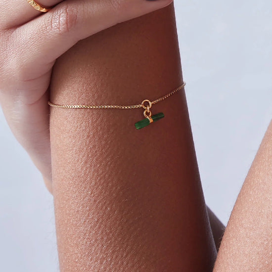 delicate gold bracelet with green malachite t bar charm with lobster clasp from rachel jackson model shot