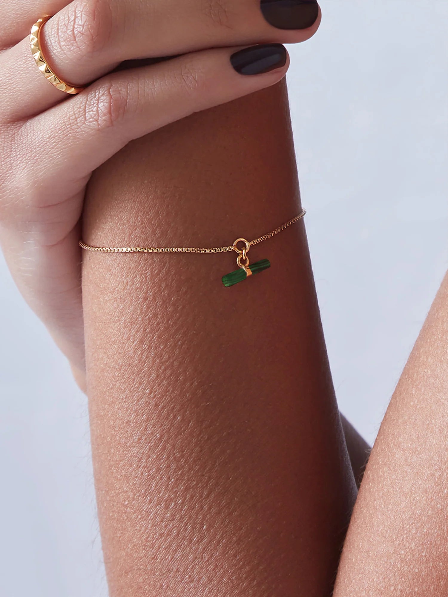 delicate gold bracelet with green malachite t bar charm with lobster clasp from rachel jackson model shot