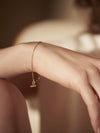 mini malachite gold bracelet on a delicate chain and lobster clasp from rachel jackson model shot