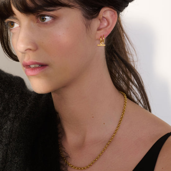 mini t bar huggie earrings gold from rachel jackson model shot