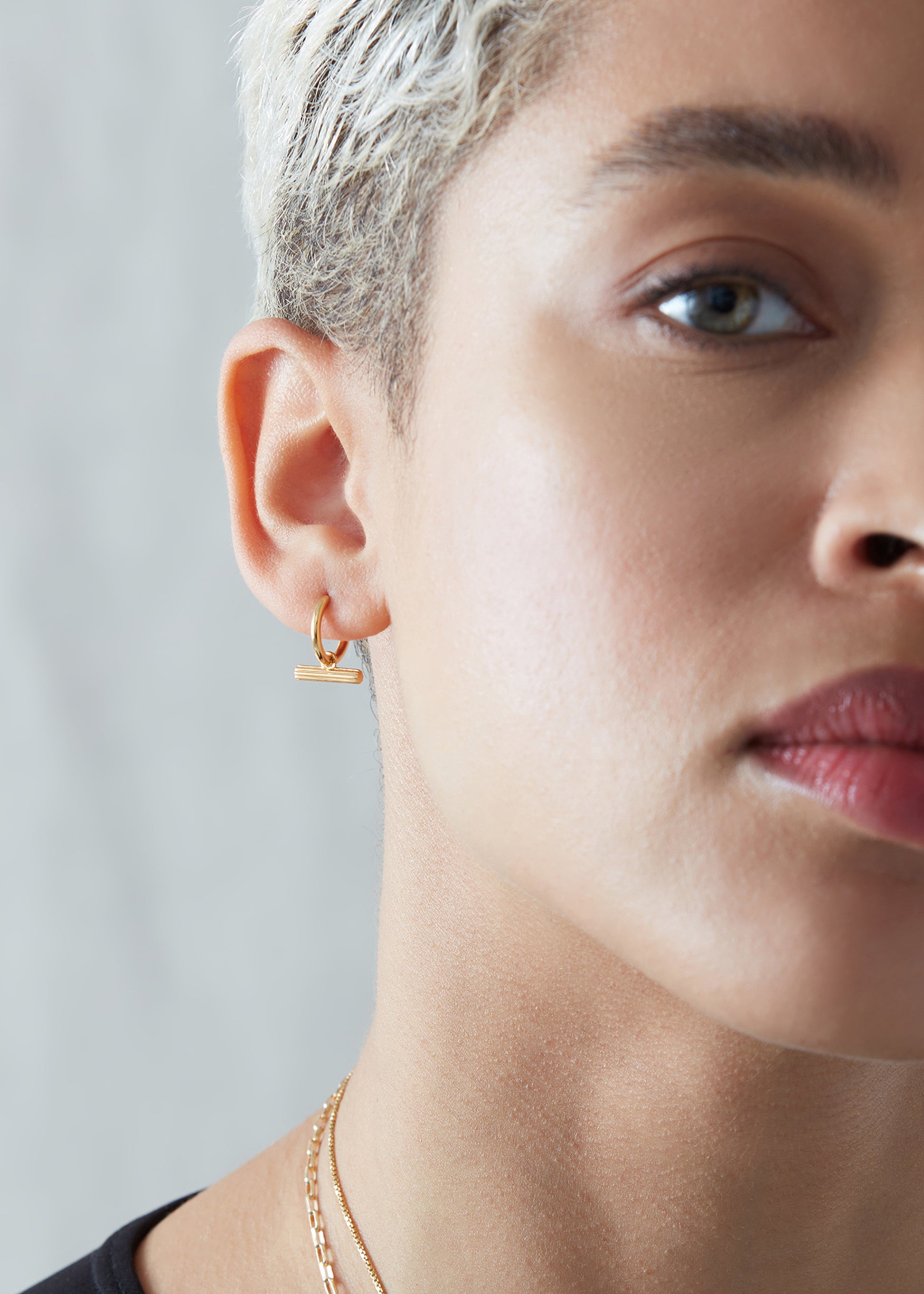 mini t bar huggie earrings gold from rachel jackson model shot