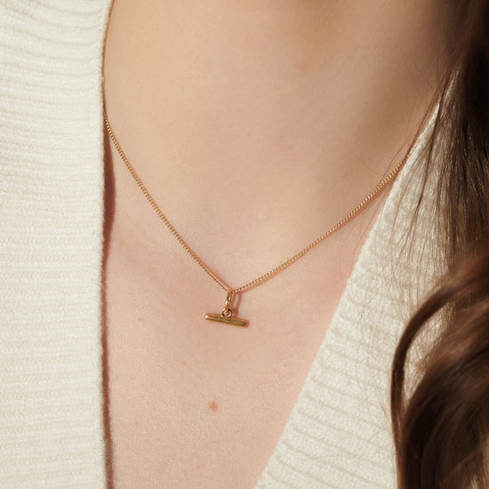 gold t-bar mini necklace on a delicate gold chain from rachel jackson model shot