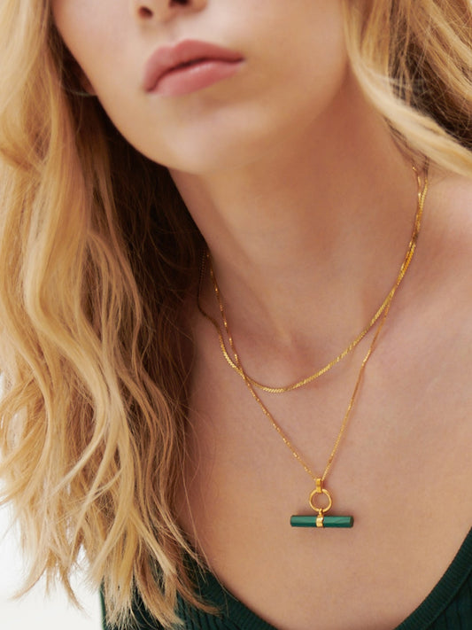 malachite stone rectangular necklace with gold ring and a delicate gold chain from rachel jackson model shot