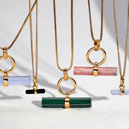 malachite stone rectangular necklace with gold ring and a delicate gold chain from rachel jackson 