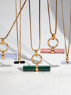 malachite stone rectangular necklace with gold ring and a delicate gold chain from rachel jackson 