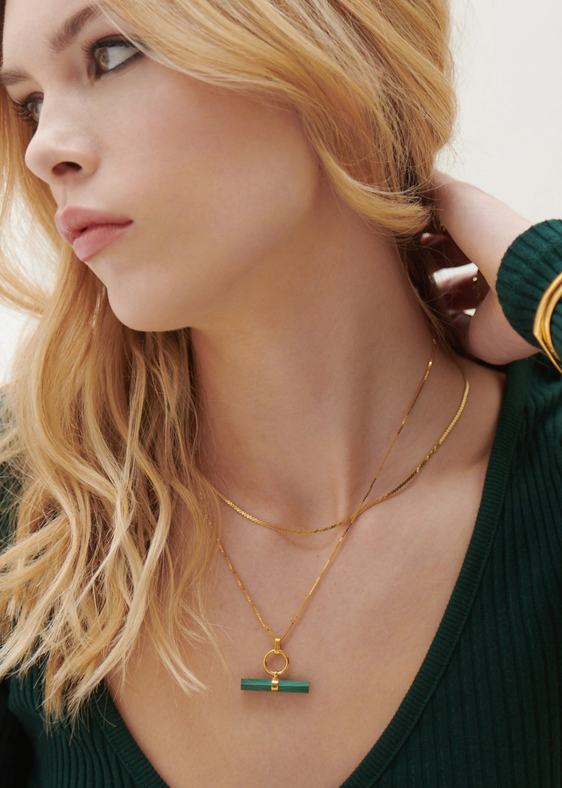 malachite stone rectangular necklace with gold ring and a delicate gold chain from rachel jackson model shot