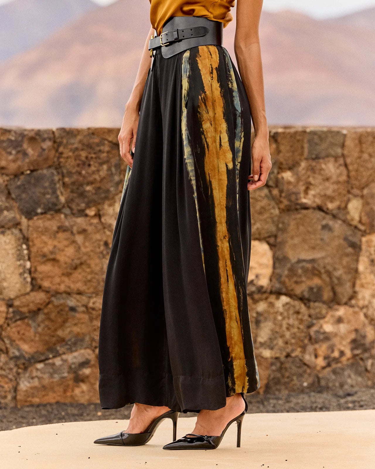 Wide leg silk trousers on model