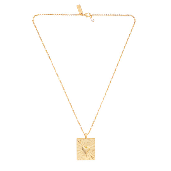 Gold necklace with rectangular gold pendant with embossed heart