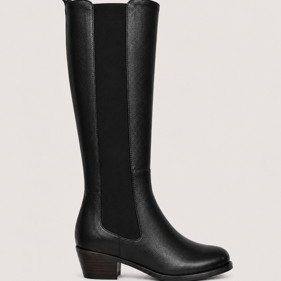 A black leather knee-high boot with elastic side panels and a low block heel, shown in profile against a light gray background.