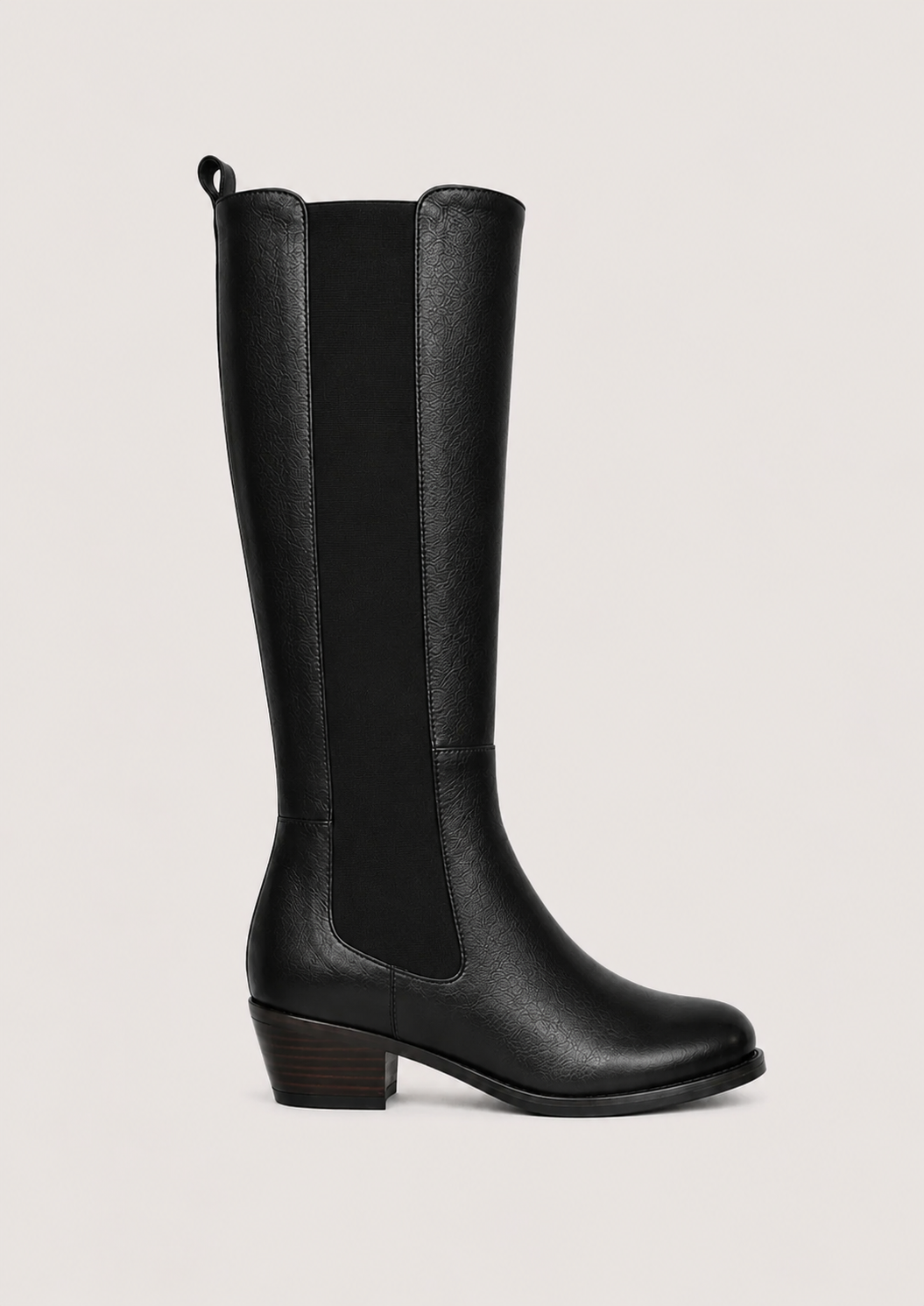 A black leather knee-high boot with elastic side panels and a low block heel, shown in profile against a light gray background.
