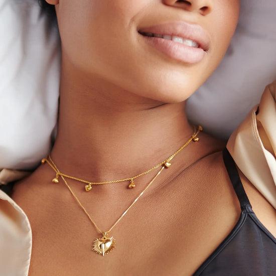 gold necklace with gold heart charms from rachel jackson